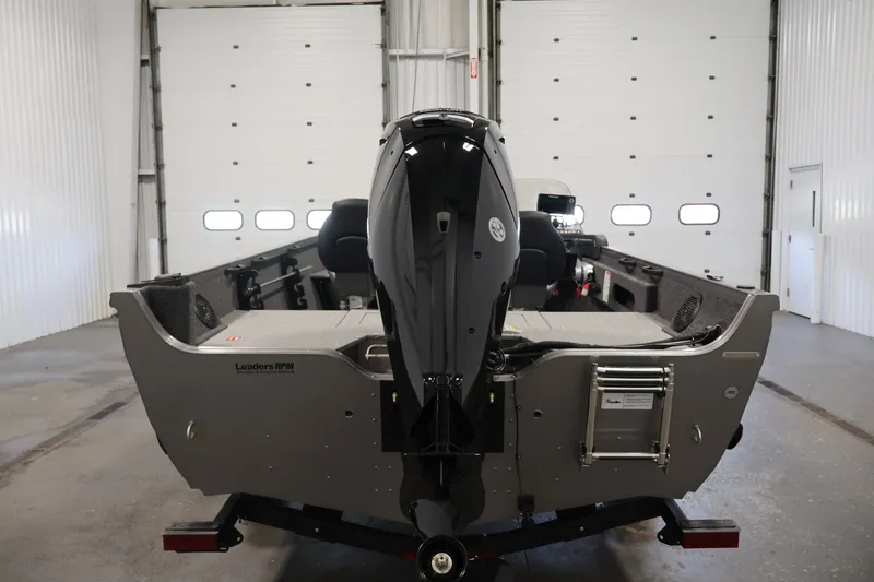 Slide: The Image of 2026 Crestliner 1750 Fish Hawk SC boat in a garage, rear view. - 12