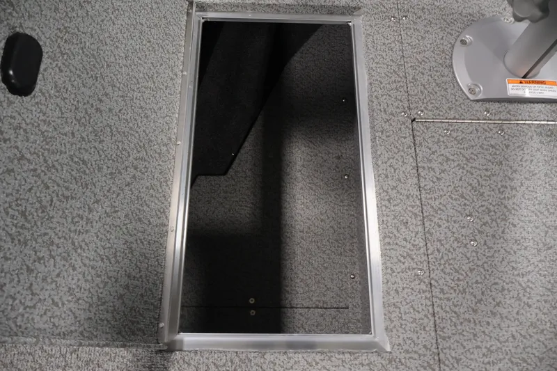 Slide: The Image of Open storage compartment on 2026 Crestliner 1750 Fish Hawk SC boat deck. - 20