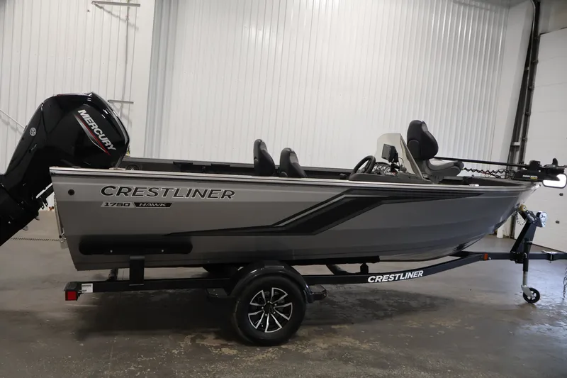Slide: The Image of 2026 Crestliner 1750 Fish Hawk SC boat on trailer in indoor setting. - 10