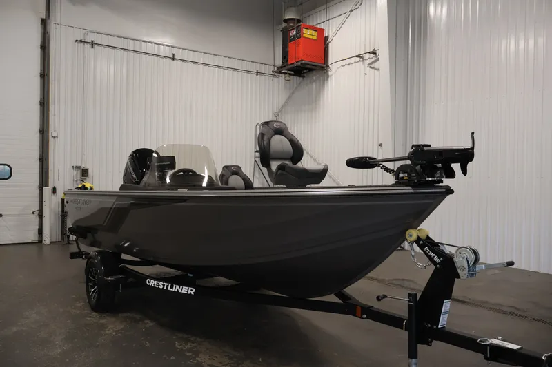 Slide: The Image of 2026 Crestliner 1750 Fish Hawk SC boat in a showroom, side view. - 9