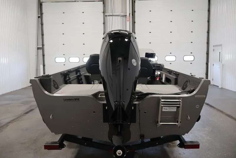 Slide: The Image of 2026 Crestliner 1750 Fish Hawk SC boat in a garage, rear view. - 13