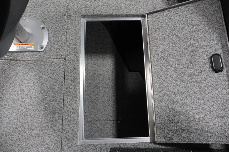 Slide: The Image of Open storage compartment on 2026 Crestliner 1750 Fish Hawk SC boat deck. - 21