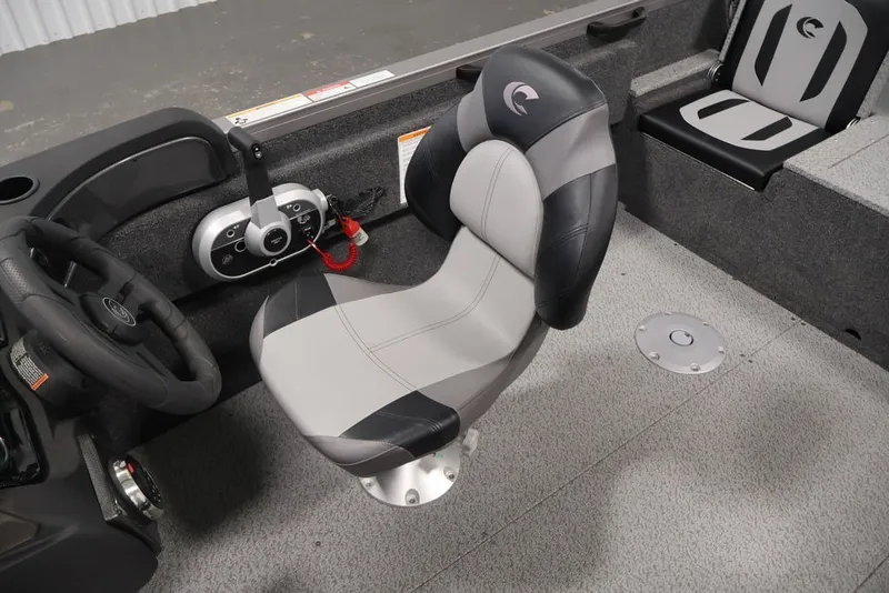 Slide: The Image of 2026 Crestliner 1750 Fish Hawk SC boat interior with steering wheel and seating. - 45