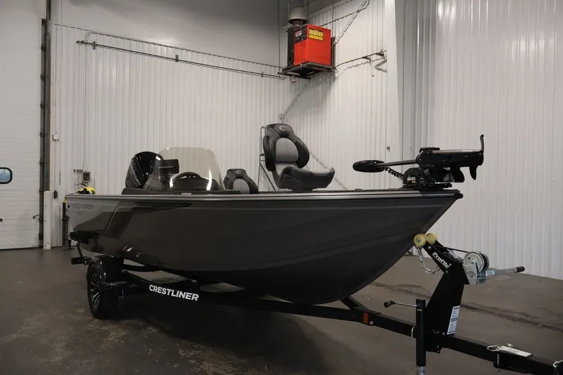 Slide: The Image of 2026 Crestliner 1750 Fish Hawk SC boat in a showroom, side view. - 9