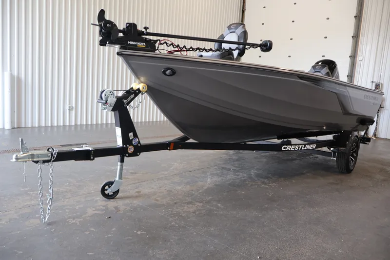 Slide: The Image of 2026 Crestliner 1750 Fish Hawk SC boat on trailer in indoor setting. - 43