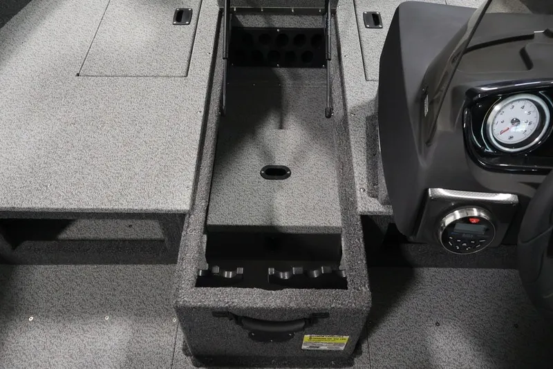 Slide: The Image of 2026 Crestliner 1750 Fish Hawk SC interior with storage compartments and dashboard view. - 19