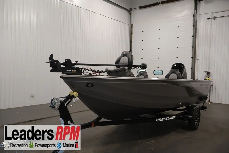 The Image of 2026 Crestliner 1750 Fish Hawk SC boat in showroom, featuring Minn Kota trolling motor. - 8