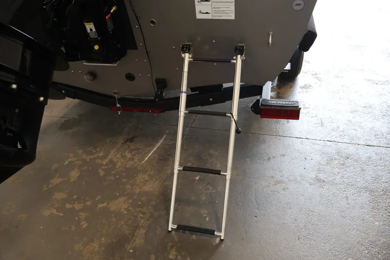 Slide: The Image of Rear view of 2026 Crestliner 1750 Fish Hawk SC with ladder extended. - 41