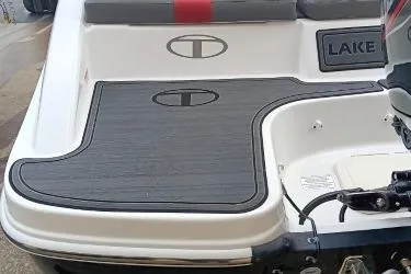 Slide: The Image of 2024 Tahoe T16 boat with sleek deck design and logo detailing. - 6