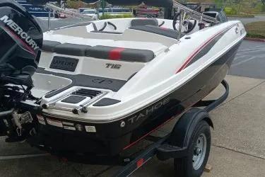Slide: The Image of 2024 Tahoe T16 boat on trailer, featuring sleek design and Mercury engine. - 8
