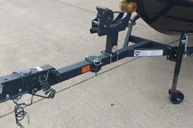 Slide: The Image of 2024 Tahoe T16 trailer hitch on concrete surface, featuring sturdy construction and safety features. - 9
