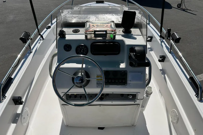 Slide: The Image of 1996 Wellcraft 160 Fisherman boat console with steering wheel and control panel. - 10
