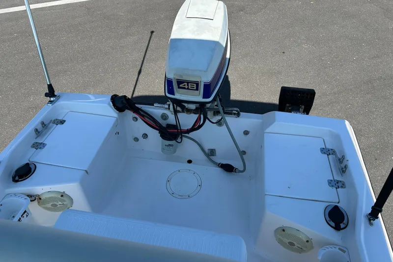 Slide: The Image of 1996 Wellcraft 160 Fisherman boat with outboard motor, viewed from the rear deck. - 11