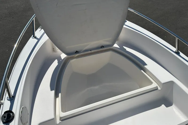 Slide: The Image of Open storage compartment on a 1996 Wellcraft 160 Fisherman boat. - 12