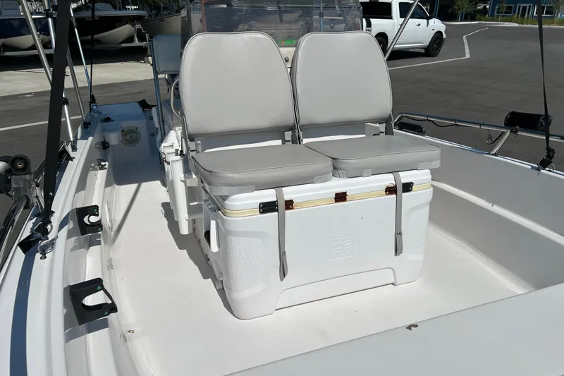 Slide: The Image of 1996 Wellcraft 160 Fisherman boat interior with dual seats and cooler. - 9