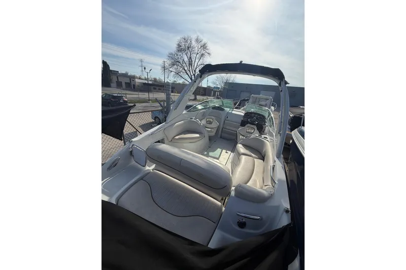 Slide: The Image of 2020 Crownline 286 SC boat interior with plush seating and modern dashboard. - 10