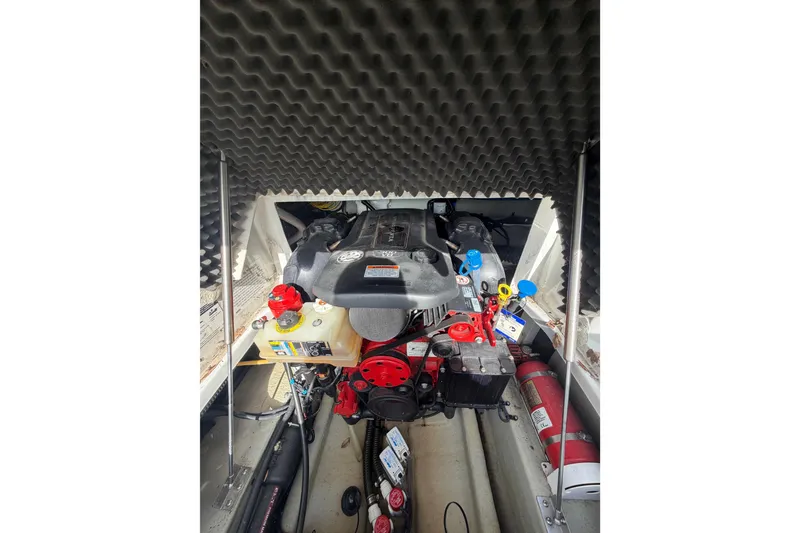 Slide: The Image of Engine compartment of 2020 Crownline 286 SC boat with visible components and fire extinguisher. - 11