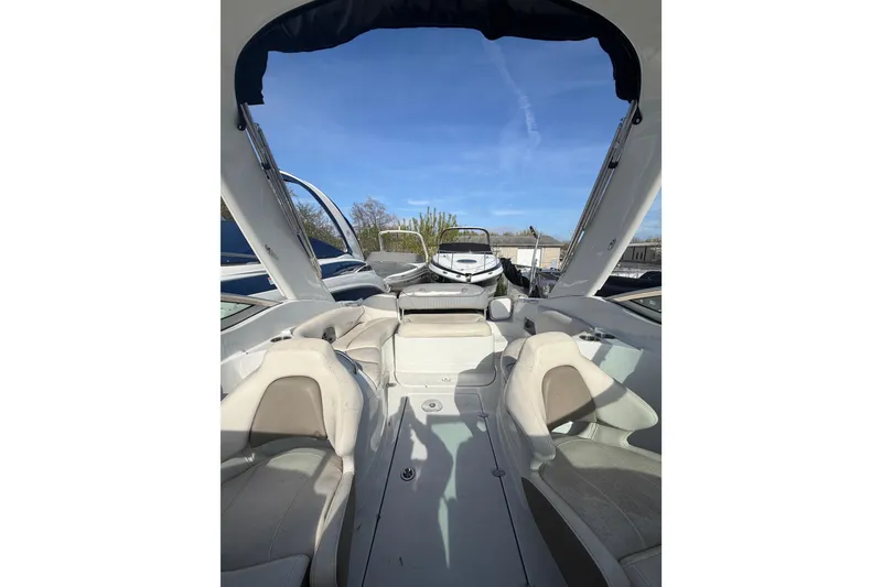 Slide: The Image of Interior view of 2020 Crownline 286 SC boat with seating and open canopy. - 14