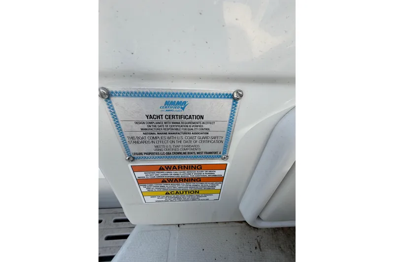 Slide: The Image of Yacht certification label on 2020 Crownline 286 SC boat, displaying safety compliance warnings. - 15