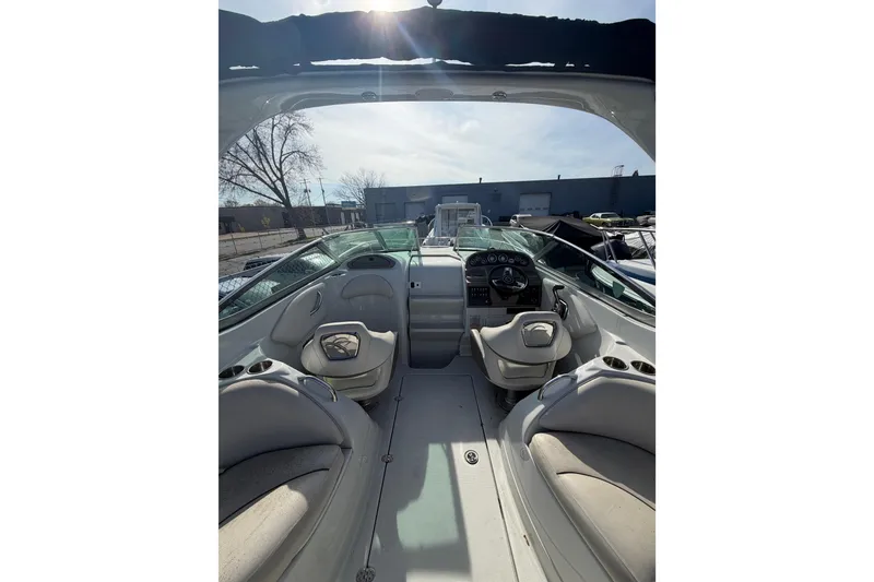 Slide: The Image of Interior view of 2020 Crownline 286 SC boat, featuring seating and dashboard. - 17