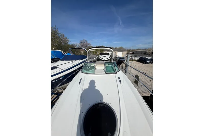 Slide: The Image of 2020 Crownline 286 SC boat docked under clear blue sky. - 5