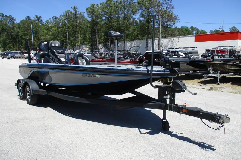 Slide: The Image of 2022 Nitro Z20 boat on trailer in outdoor dealership lot. - 12