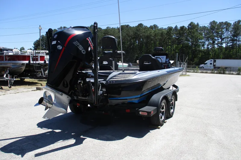 Slide: The Image of 2022 Nitro Z20 boat with powerful engine, parked outdoors on a sunny day. - 14