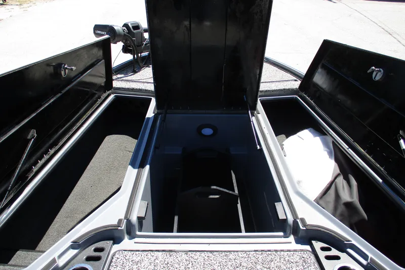 Slide: The Image of 2022 Nitro Z20 boat storage compartments open, showcasing spacious interior design. - 18
