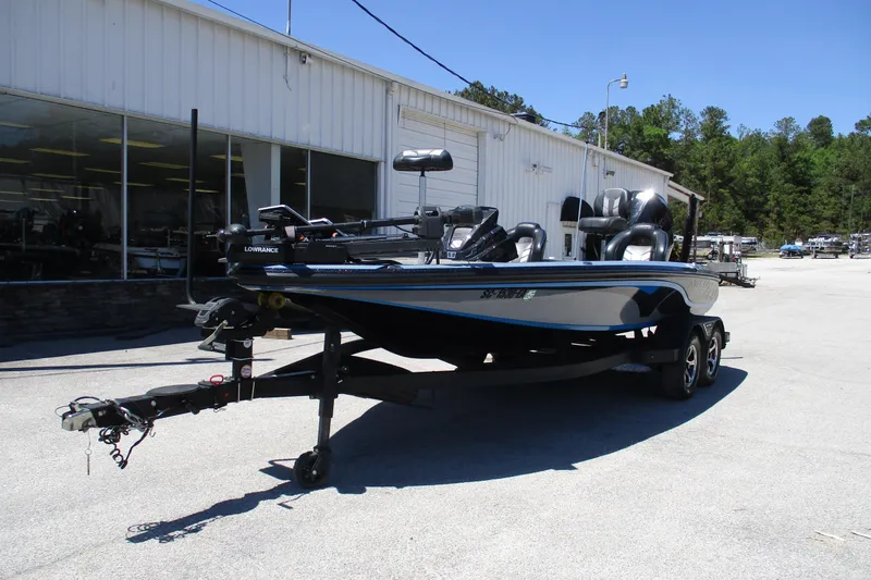 Slide: The Image of 2022 Nitro Z20 fishing boat on trailer outside dealership. - 2