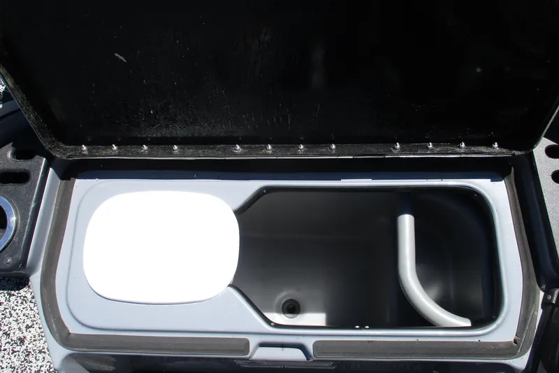 Slide: The Image of Open storage compartment in 2022 Nitro Z20 boat, featuring a sleek, modern design. - 23