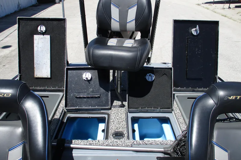 Slide: The Image of 2022 Nitro Z20 boat interior with open storage compartments and seating. - 25