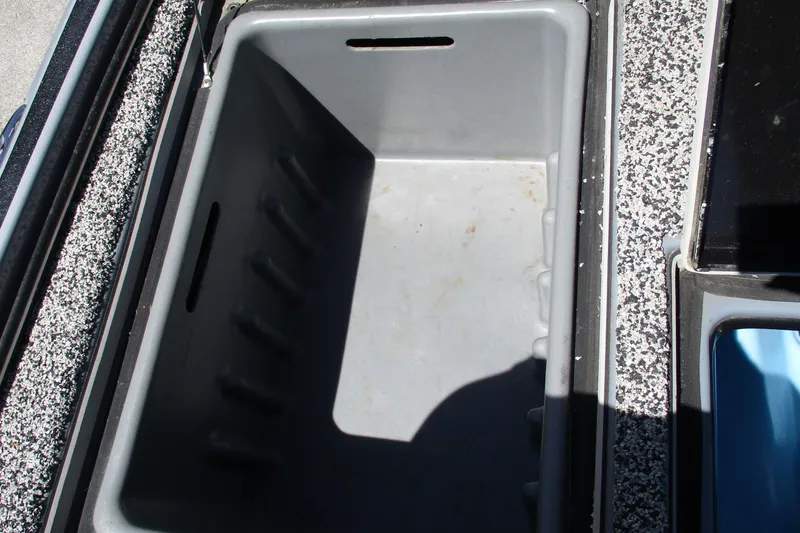 Slide: The Image of Empty storage compartment in a 2022 Nitro Z20 boat. - 29