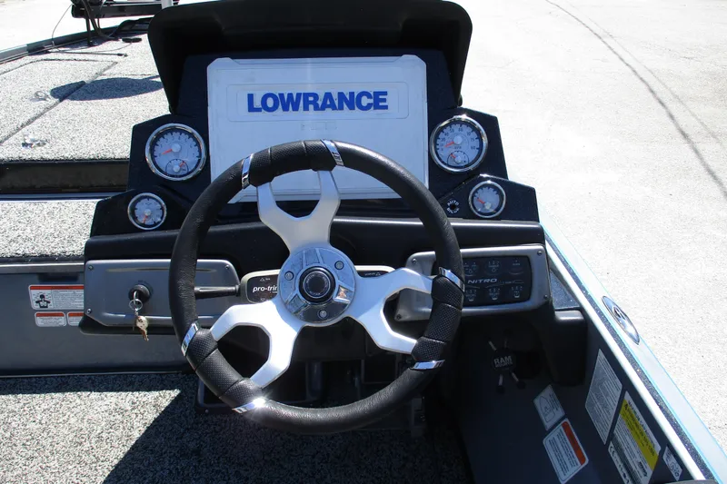 Slide: The Image of Steering console of a 2022 Nitro Z20 boat with Lowrance display and gauges. - 32