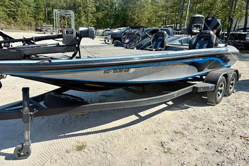 Slide: The Image of 2022 Nitro Z20 boat on trailer, parked outdoors, featuring sleek design and dual seats. - 5