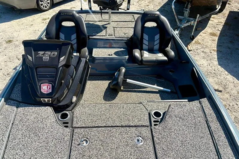 Slide: The Image of 2022 Nitro Z20 boat interior with two seats and fishing gear. - 8