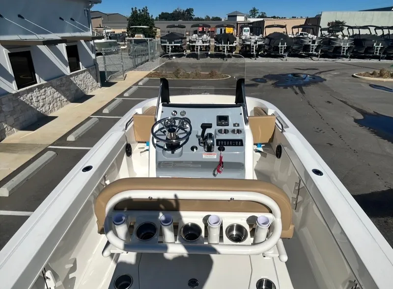 Slide: The Image of 2026 Bayliner TROPHY CC20 boat cockpit view outdoors. - 10