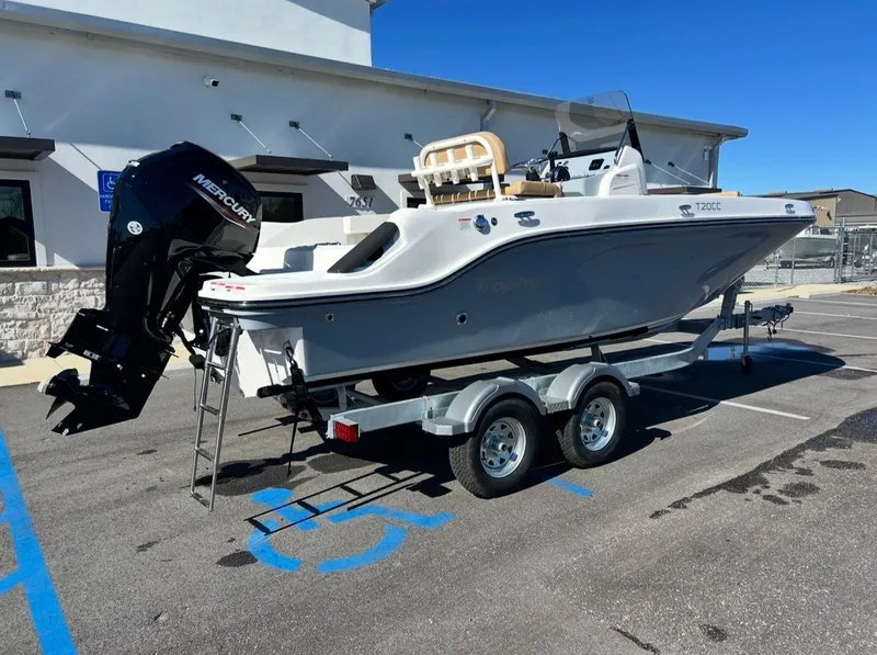 Slide: The Image of 2026 Bayliner TROPHY CC20 boat parked on trailer outdoors. - 3