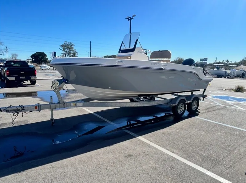 Slide: The Image of 2026 Bayliner TROPHY CC20 boat parked on trailer outdoors. - 7