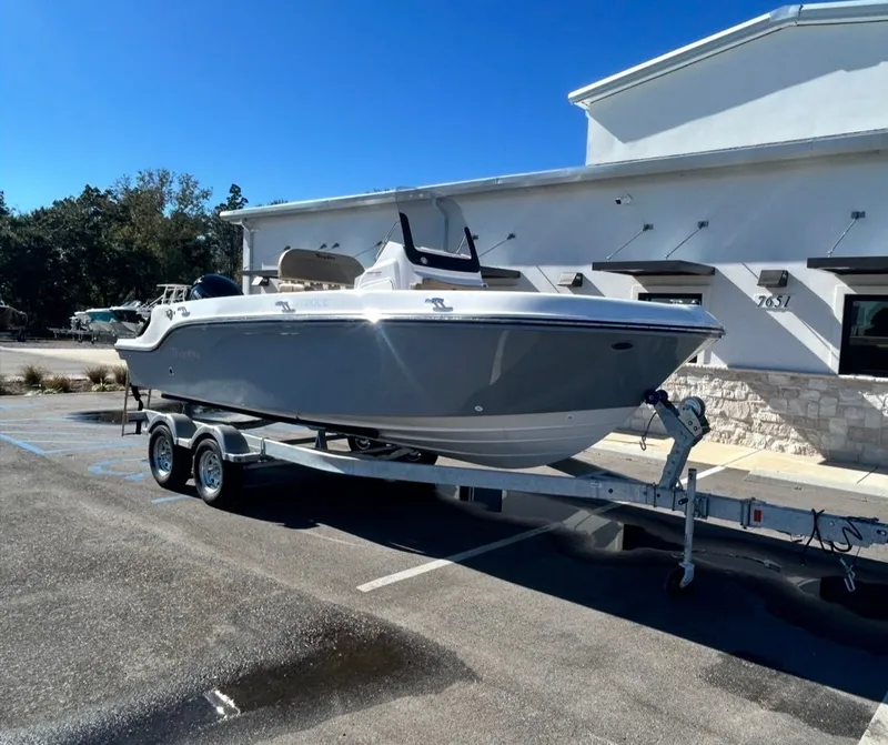 Slide: The Image of 2026 Bayliner TROPHY CC20 on trailer outside building. - 8