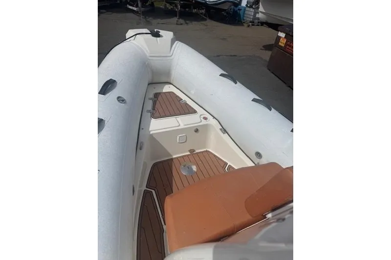 Slide: The Image of 2019 Brig Navigator 570 inflatable boat interior with teak flooring and seating. - 6