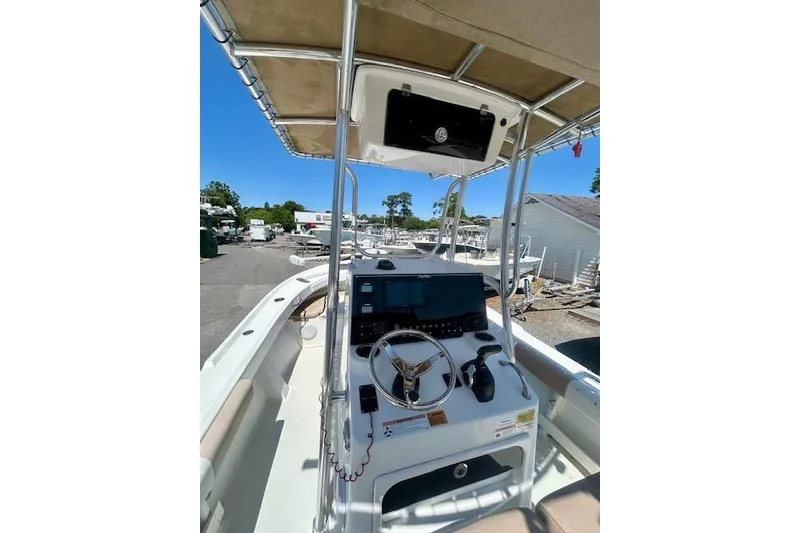 Slide: The Image of Cockpit view of 2019 Parker 21 Special Edition boat with steering wheel and controls. - 6