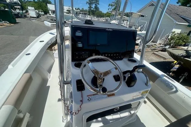Slide: The Image of 2019 Parker 21 Special Edition boat dashboard with steering wheel and controls. - 7
