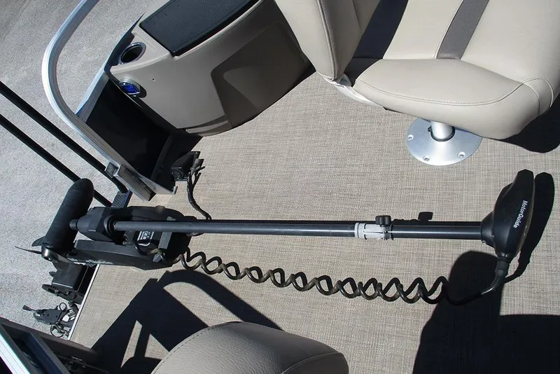 Slide: The Image of 2023 Sun Tracker Bass Buggy 18 DLX boat interior with trolling motor and seating. - 10