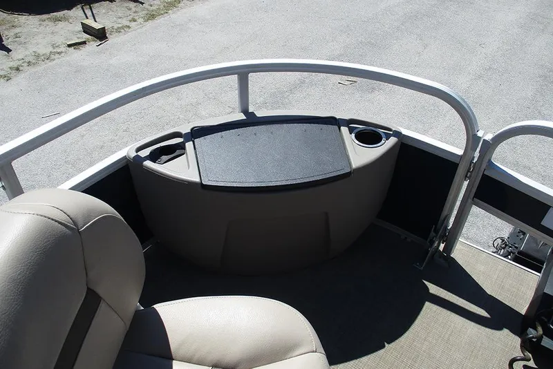 Slide: The Image of 2023 Sun Tracker Bass Buggy 18 DLX pontoon boat interior with seating and storage. - 13