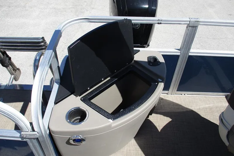 Slide: The Image of 2023 Sun Tracker Bass Buggy 18 DLX boat storage compartment with cup holder. - 21