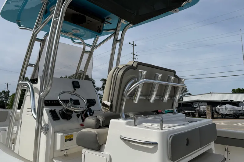 Slide: The Image of 2026 Key West 239 FS boat interior with steering console and seating. - 19