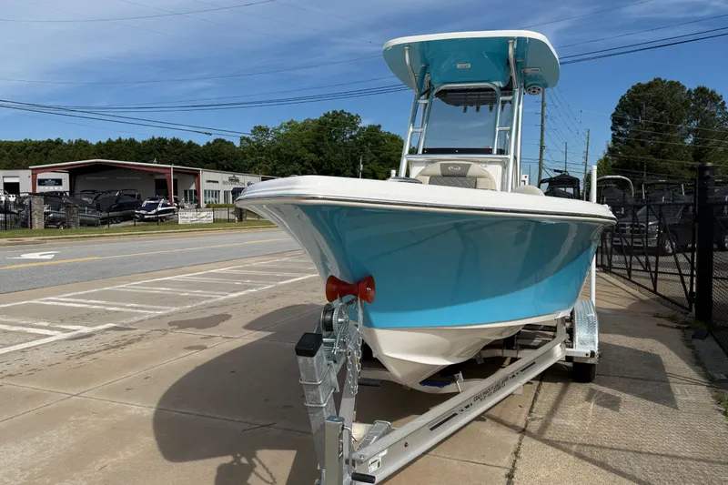 Slide: The Image of 2026 Key West 239 FS boat on trailer, parked outdoors near dealership. - 2