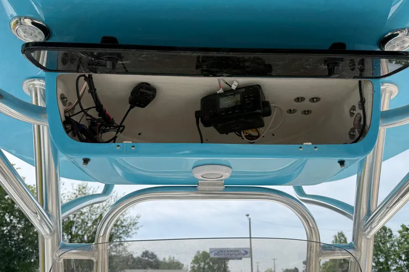 Slide: The Image of 2026 Key West 239 FS boat electronics compartment with wiring and equipment. - 22