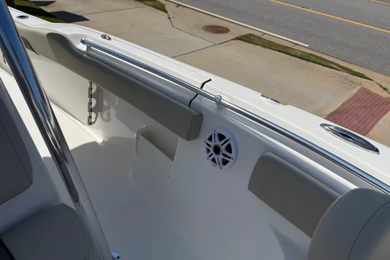 Slide: The Image of 2026 Key West 239 FS boat interior with cushioned seating and speaker. - 35
