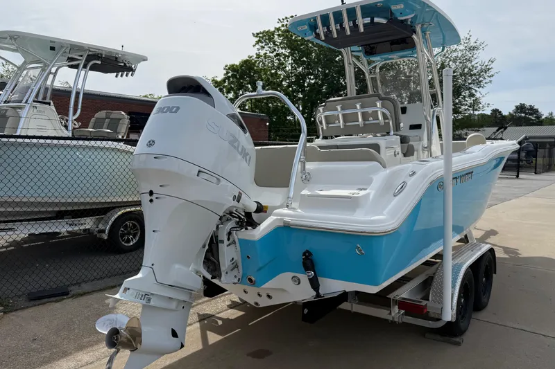 Slide: The Image of 2026 Key West 239 FS boat with Suzuki 300 engine on trailer, blue and white design. - 4